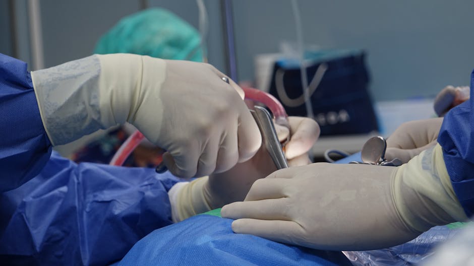 Close-up of surgeons operating in a hospital theater setting with precision.